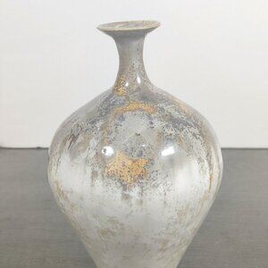 Artist signed narrow neck vase with exquisite glazing in gold, brown & tan.